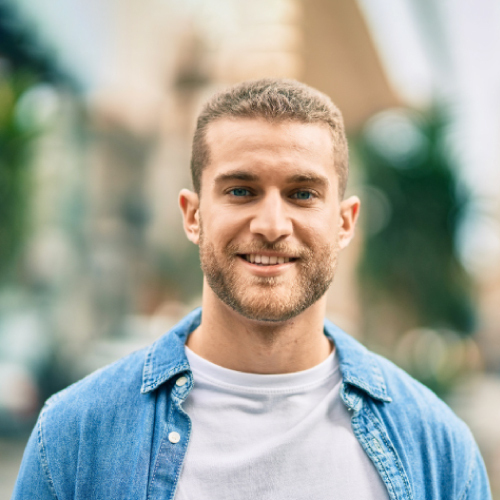 Portrait of Young Man Smiling at Camera
