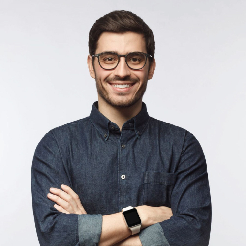 young man wearing spectacles and smartwatch looking at camera with smile