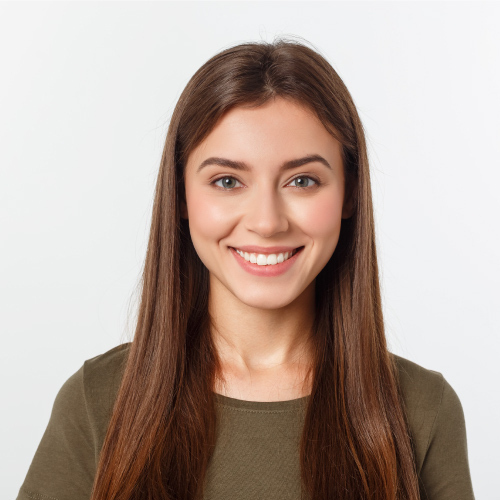 Close-up portrait of yong woman with beatiful smile posing in studio over white background.